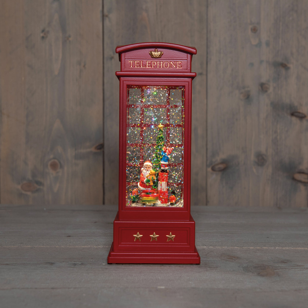 telefooncel met trein roterend in glitterwater led op 3aa batterij met dc aansluiting 25x10.5cm warm wit