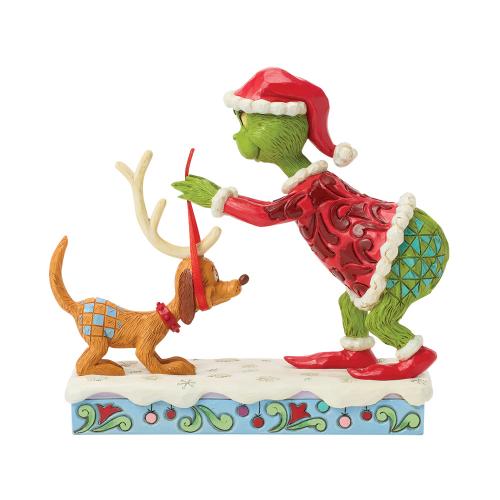 the grinch tying antlers on max - the grinch by jim shore