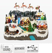 dorp met kerstman slee, led, muziek en beweging 59cm